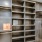 a room with shelves and a sign