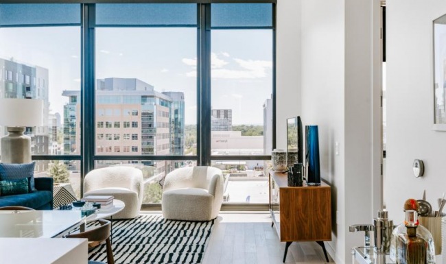 Wide open living areas flooded with natural light a room with a large window