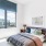 a bedroom with a large window