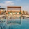 a swimming pool with a building in the background