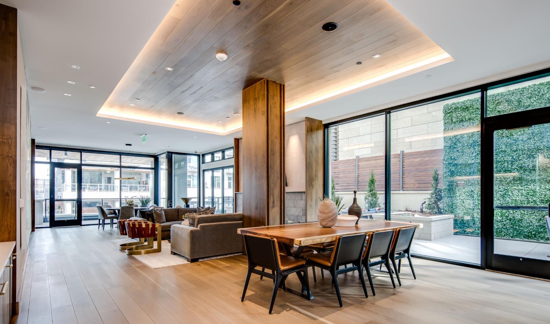 Enjoy our resident-only features a large room with a table and chairs and a large window