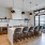a kitchen with a bar and chairs