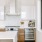 a kitchen with white cabinets